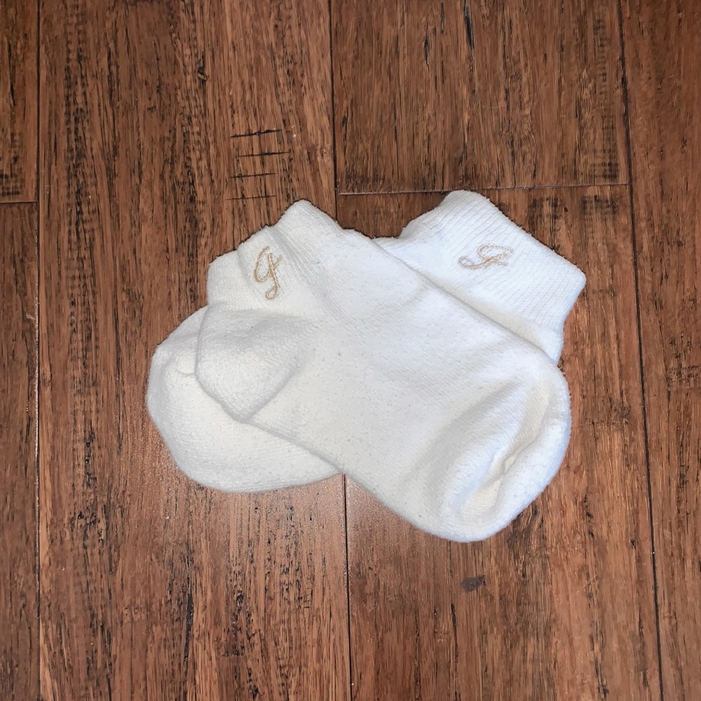 White socks with gold emblem